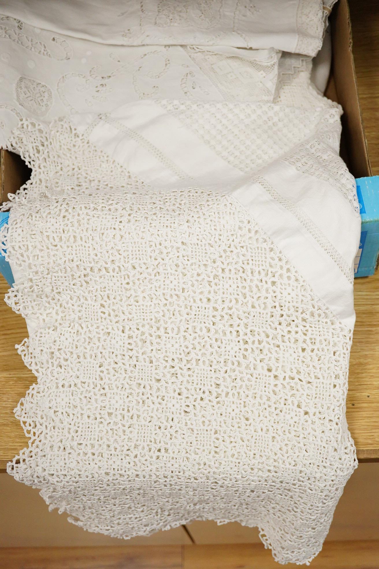 A collection of cutwork, needlework, filet, crochet and drawn thread worked table cloths etc